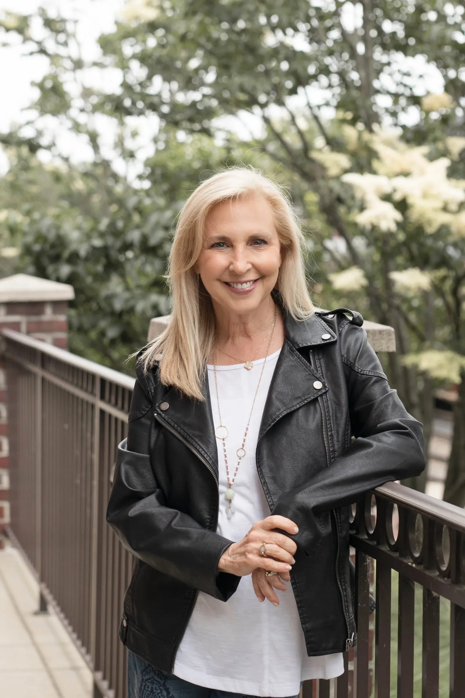 Lauren Yellin Weinberg in a leather jacket, smiling